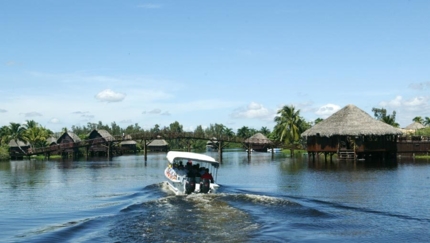 Boat ride through the Taina Village, LIVING AUTHENTIC CUBA Group Tour
